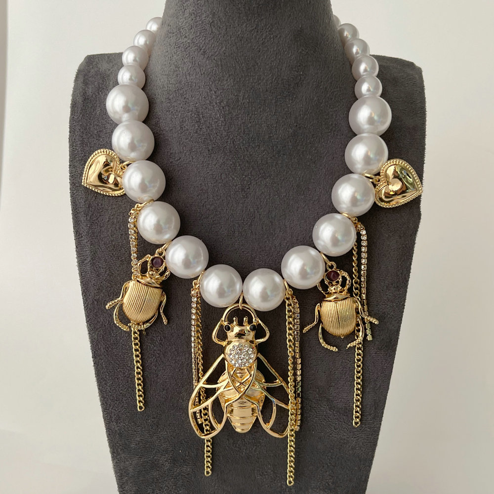 Glass pearl bee charm necklace