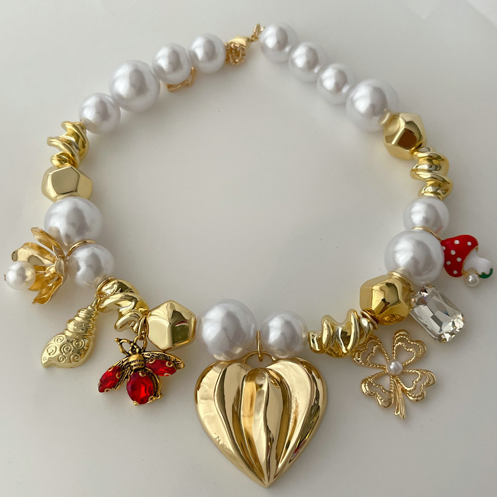 Glass pearl heart charm necklace