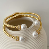 Twist pearl bangle