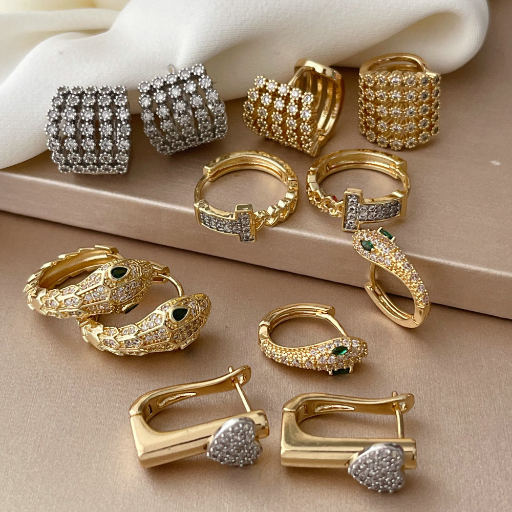 Pave two tone heart snake earrings