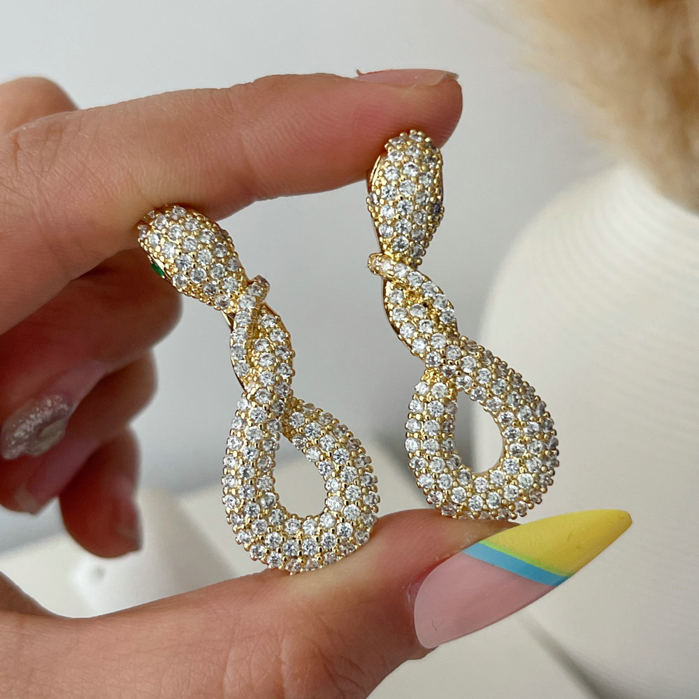 Pave zircon snake earrings