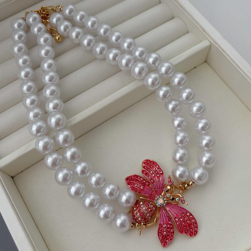 Butterfly charm glass pearl necklace