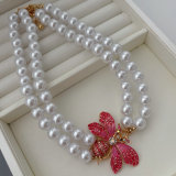 Butterfly charm glass pearl necklace
