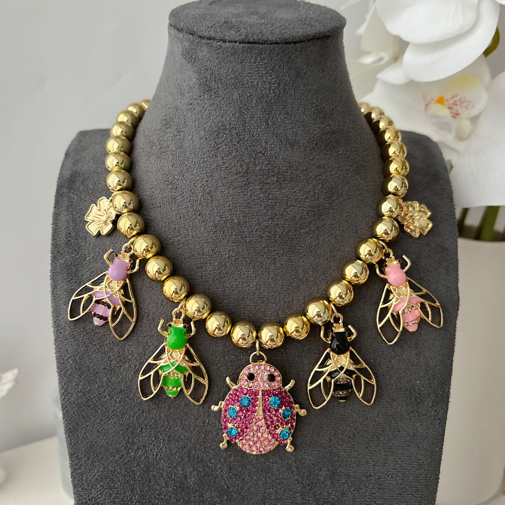 Inset charm balll necklace