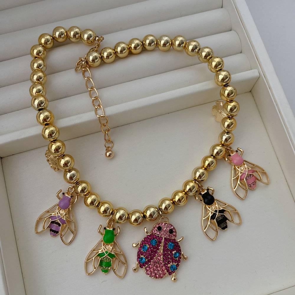 Inset charm balll necklace
