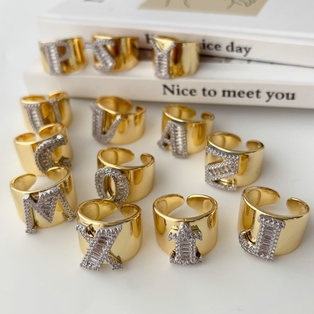 Two tone pave letter ring
