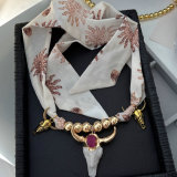 Horn charm necklace