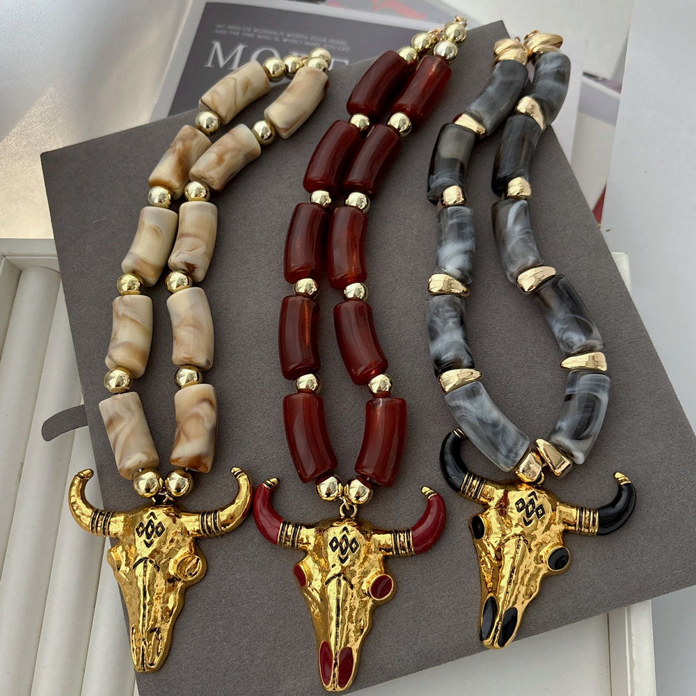 Acrylic necklace with horn pendant