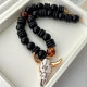 Black bead necklace with horn pendant