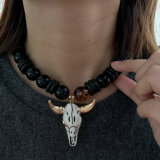 Black bead necklace with horn pendant