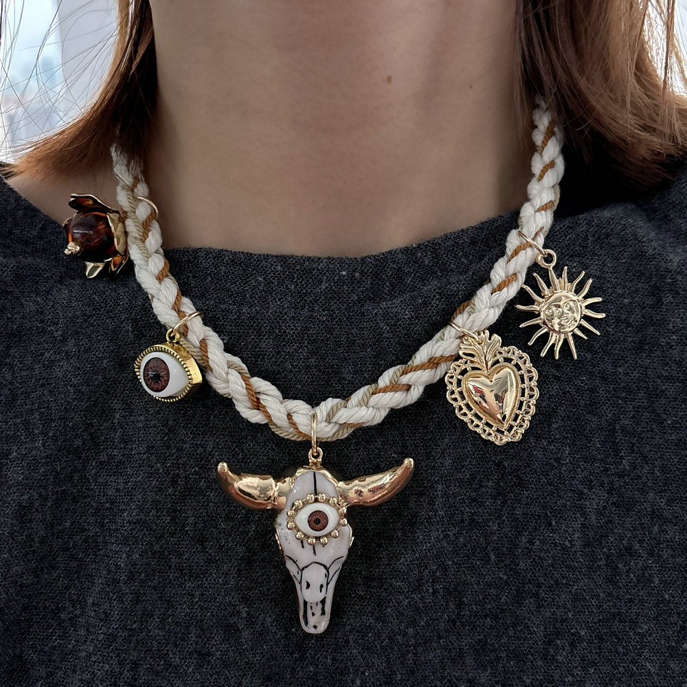 White cord necklace with horn charm