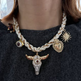 White cord necklace with horn charm
