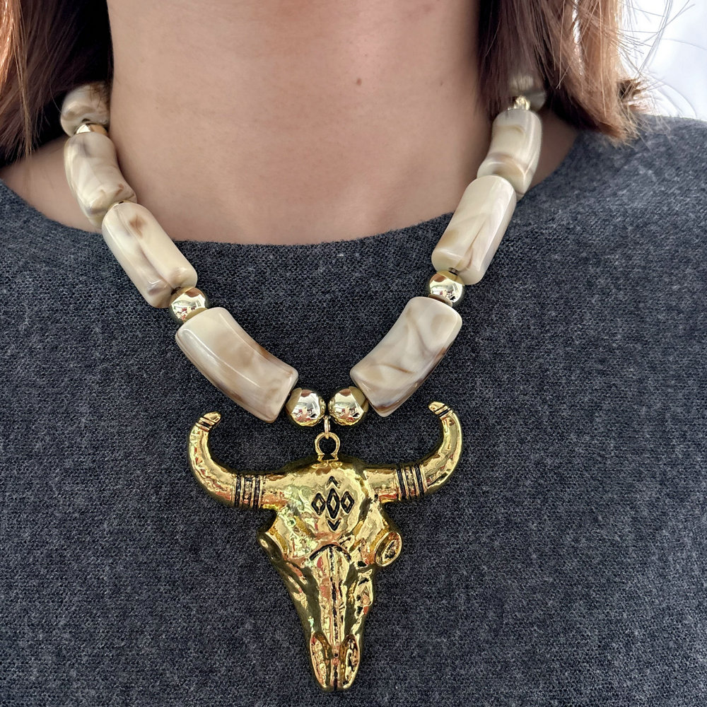 Acrylic necklace with horn pendant