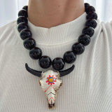 Chunky black bead necklace with bull pendant