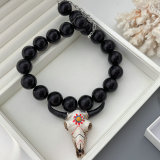 Chunky black bead necklace with bull pendant