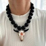 Chunky black bead necklace with bull pendant