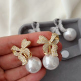 Pave bow pearl earrings