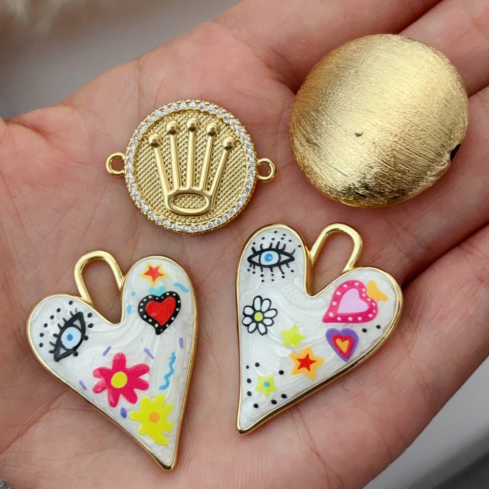 Enamel heart eye charm