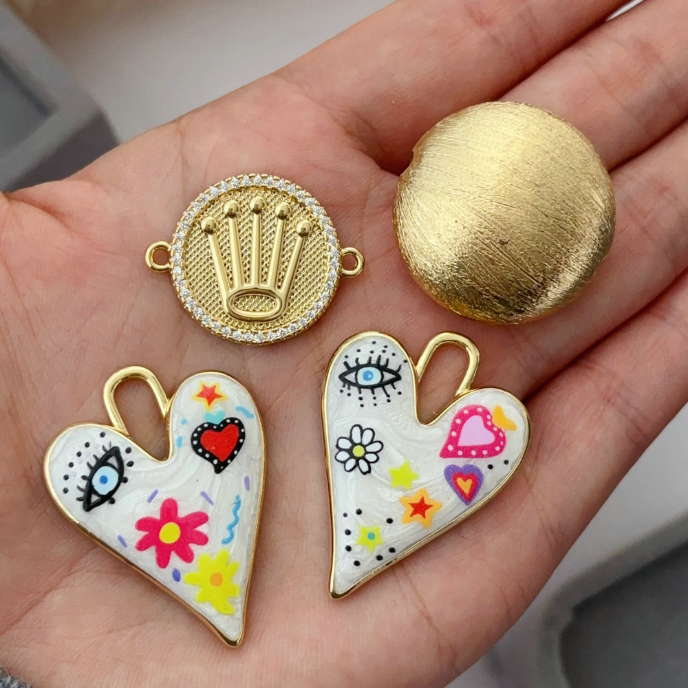Enamel heart eye charm