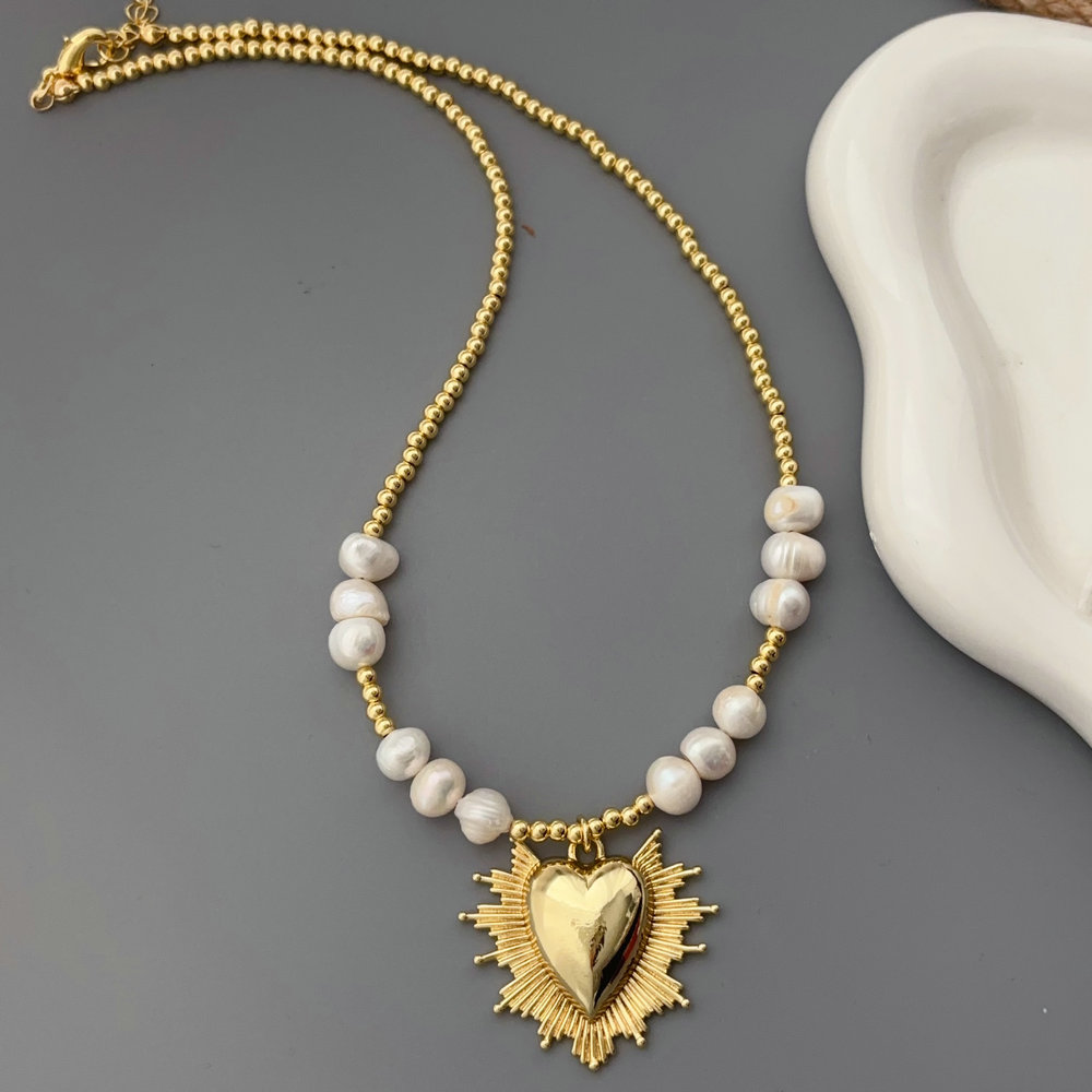Pearl necklace with heart charm