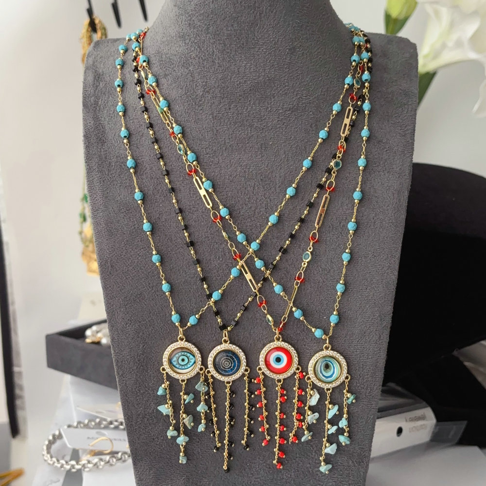 Long chain eye tassel necklace