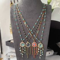 Long chain eye tassel necklace