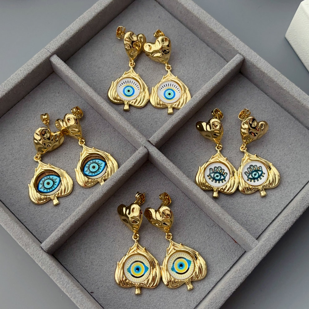 Eye charm earrings