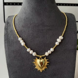Pearl necklace with heart charm