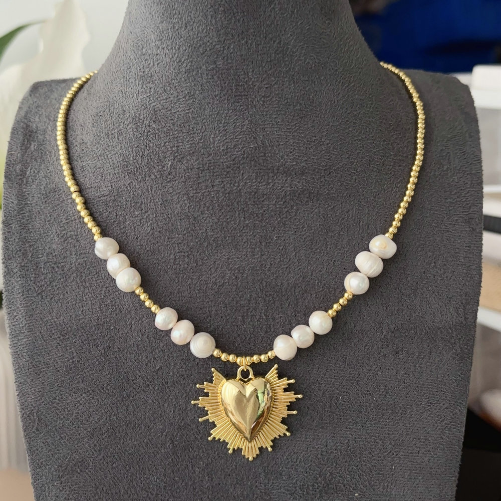 Pearl necklace with heart charm