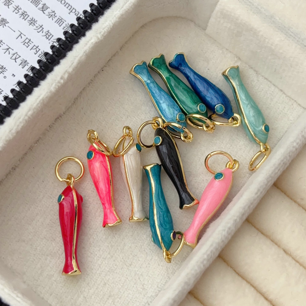 Two aide fish charm