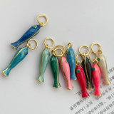 Two aide fish charm