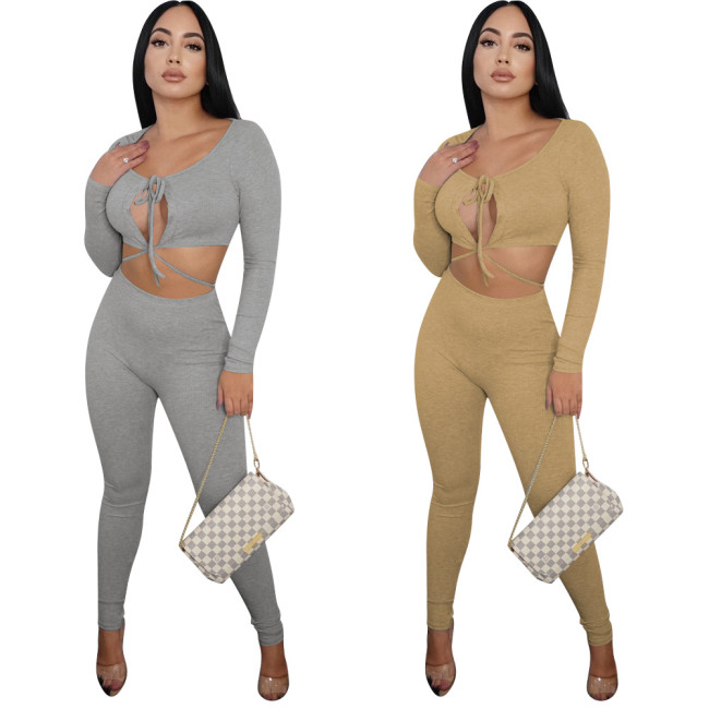 2021 autumn and winter fine pit strip fabric sexy slim fit two-color hollow out long sleeve two-piece set