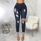 Stretch high-rise washed ripped skinny jeans
