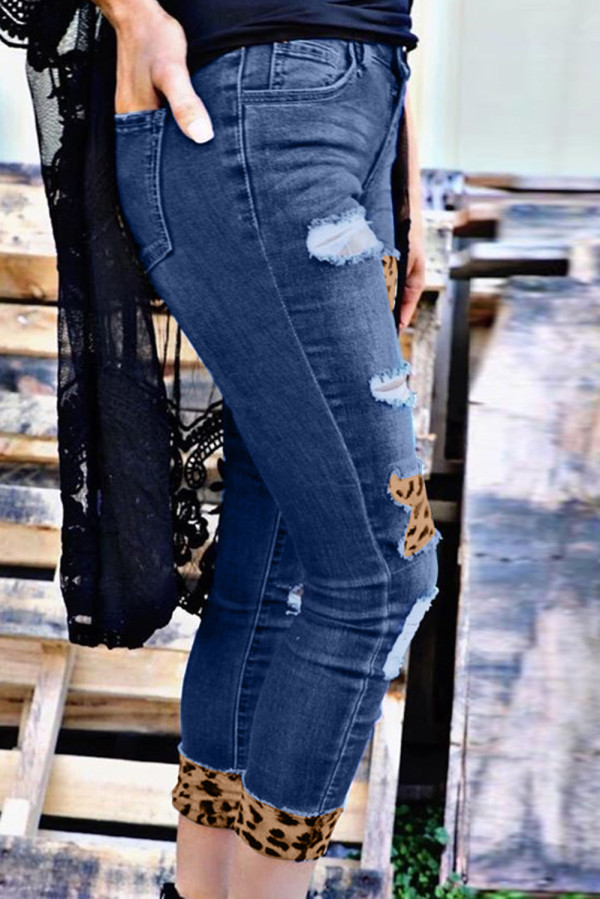 distressed jeans with leopard patches