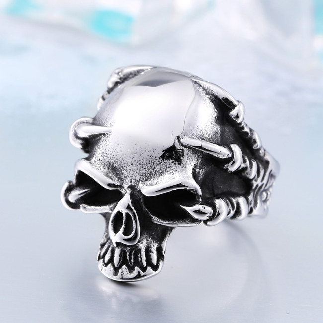 Wholesale Stainless Steel Hand Holding Skull Ring