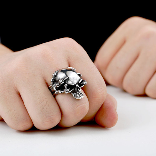 Wholesale Stainless Steel Hand Holding Skull Ring