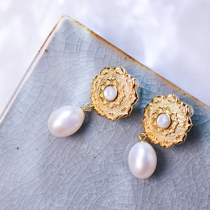 Opulent Lotus Silk Road Earrings with lustrous freshwater pearls, embracing Dunhuang-inspired design in gilded sterling silver, from Light Stone Jewellery.
