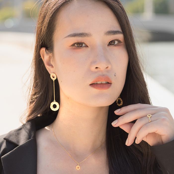 Sunrise Silk Road Earrings in gilded sterling silver with intricate Dunhuang-inspired patterns and a central lustrous gemstone, available at Light Stone Jewellery.