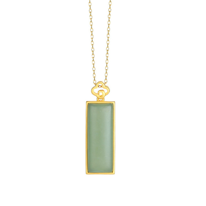 Designer Rectangle Qiemo Jade Gold Sterling Silver Necklace with light blue pendant on a white background