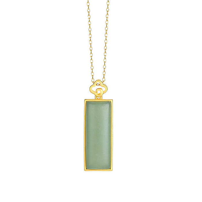Designer Rectangle Qiemo Jade Gold Sterling Silver Necklace with light blue pendant on a white background