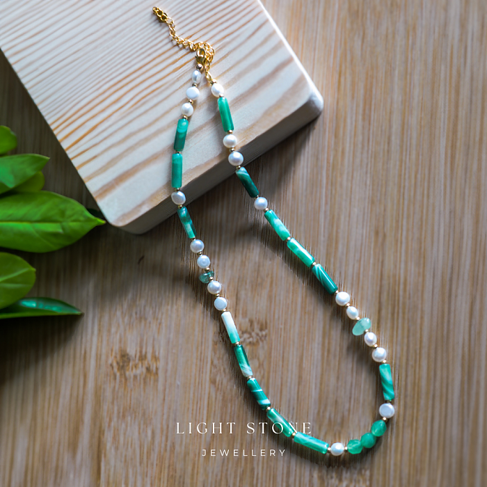 High-end designer handmade stone necklace featuring twisted-pattern agate, pearls, and Dongling jade