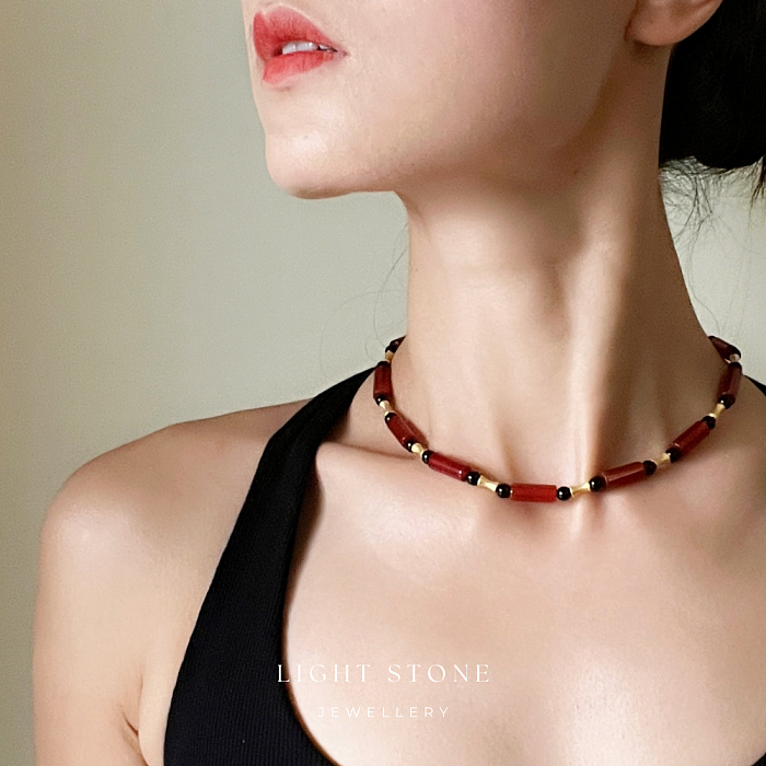 Dawn Sun designer handmade stone necklace featuring red and black agate beads