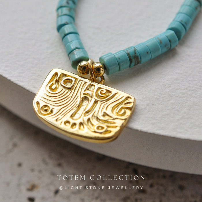 Luxurious Gold Phoenix Feather Turquoise Necklace from the Totem Collection
