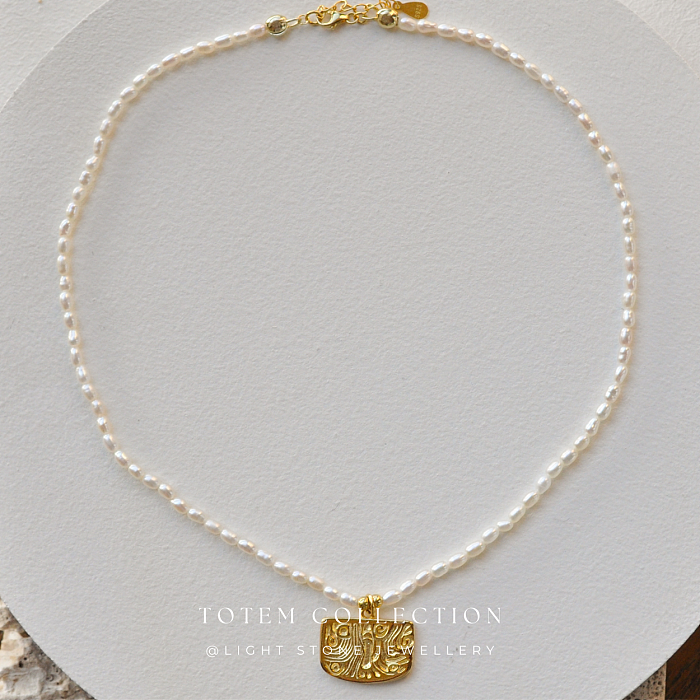 Elegant Gold Phoenix Feather Pearl Necklace from the Totem Collection