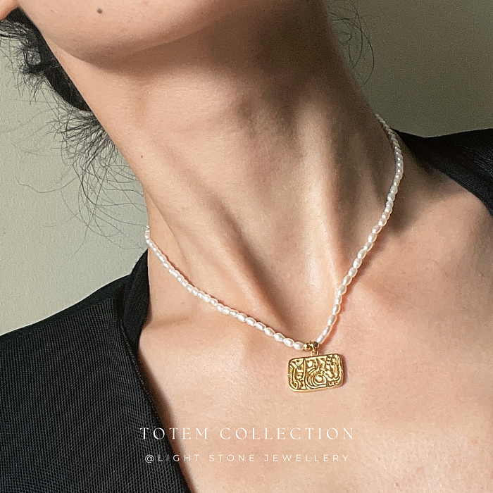 Elegant Pearl Strand with Golden Phoenix Totem Pendant in Totem Collection