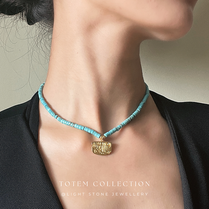 Luxurious Gold Phoenix Feather Turquoise Necklace from the Totem Collection