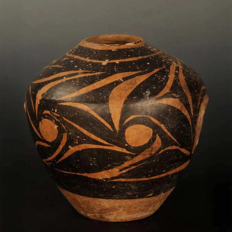 Swirl motif pottery jar