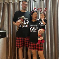Christmas Matching Family Pajamas Funny Penguins It's a Jolly Holiday Black Pajamas Set