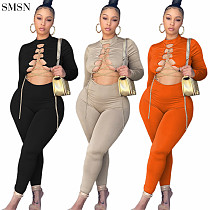 New Arrival 2021 Fall Jumpsuits Fashion Solid Color Cutaway Neck And Chain Cross Tights Jumpsuit