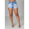 Denim shorts with holes and tassels